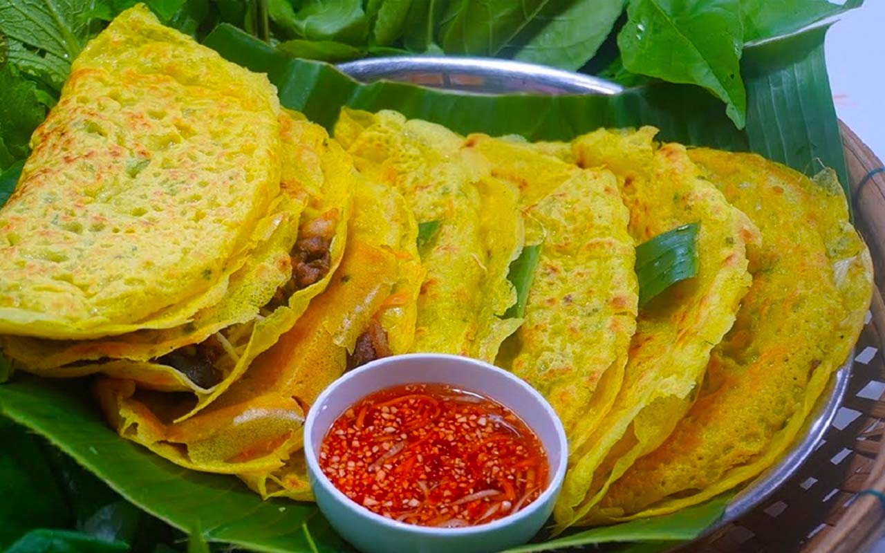 a plate of mekong-delta-style banh xeo or Vietnamese crepes.