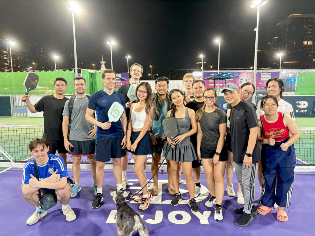 Expats and locals bonding through sports at VLS, discovering how learning Vietnamese connects people across cultures.