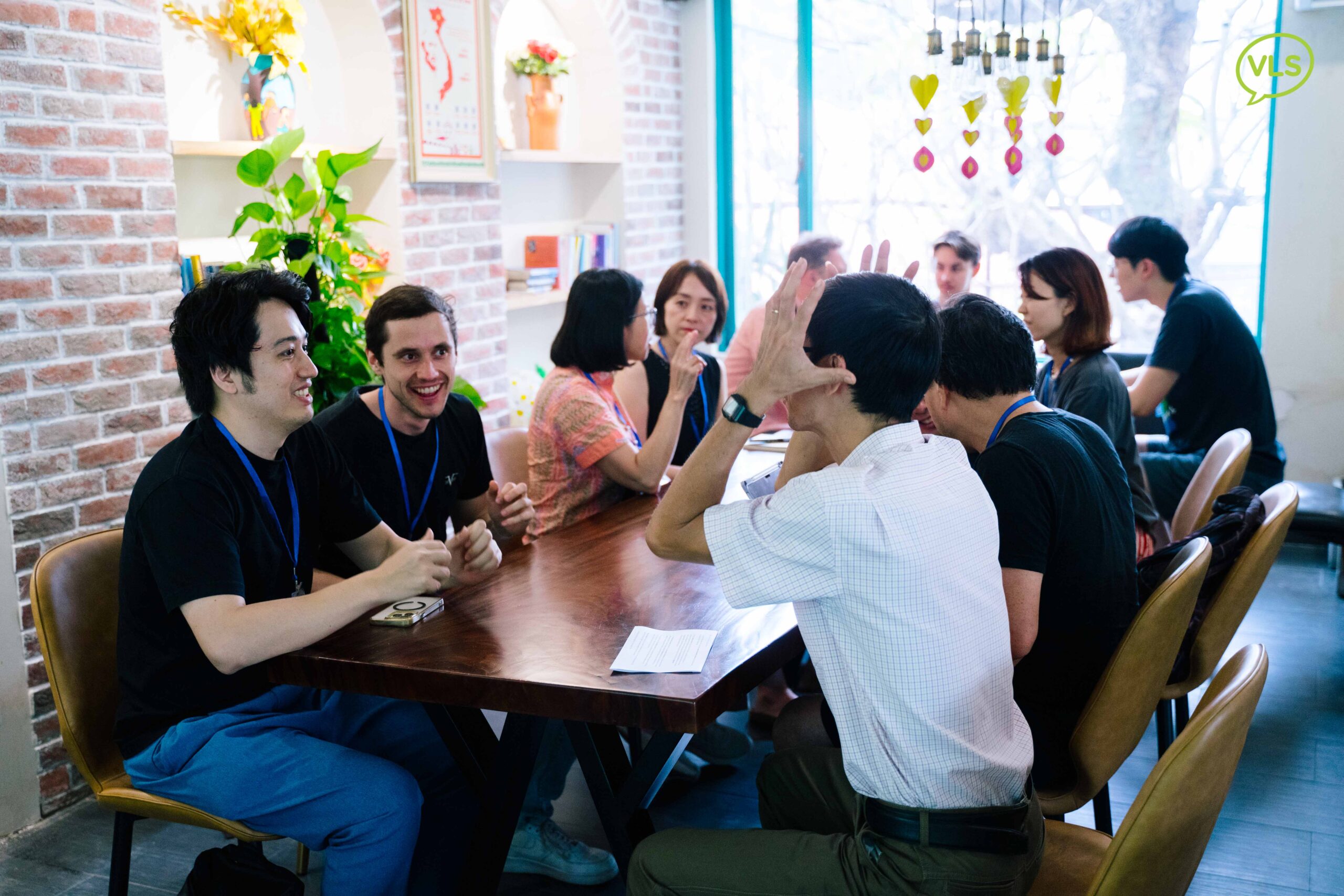 Students engaging in a Vietnamese language class through real-life conversation practice.