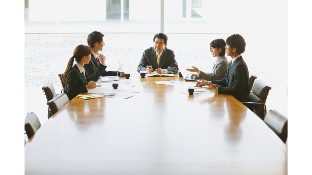 Professionals learning business Vietnamese and practicing cultural etiquette at work in Vietnam to build respect and stronger workplace relationships