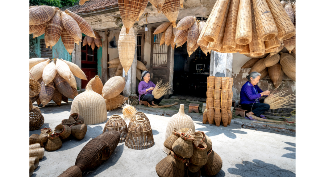 Vietnam travel guide: artisans weaving traditional bamboo handicrafts by hand, showcasing Vietnam’s local craftsmanship.